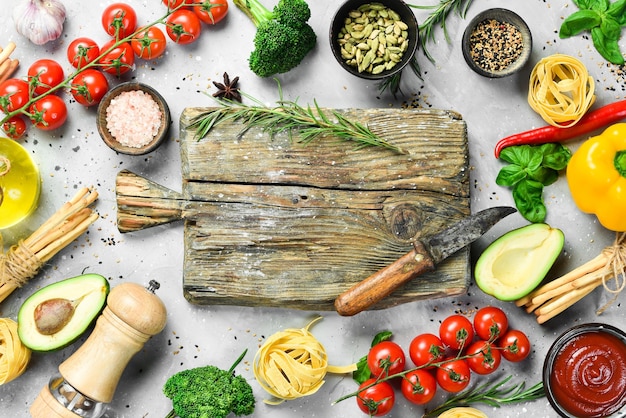 Fresh ingredients and kitchen tools on a wooden table